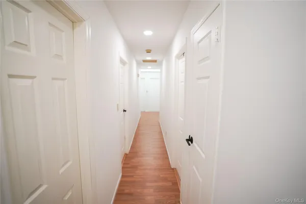 a bedroom with furniture and wooden floor