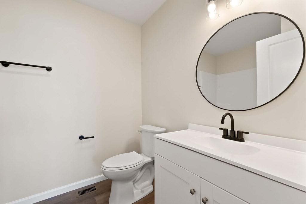 14305 Old Kentucky Road Walling, TN 38587 - Photo 20 of 31 a bathroom with a sink a mirror and a toilet