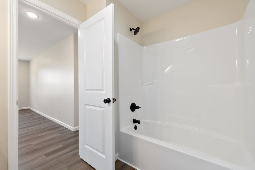 14305 Old Kentucky Road Walling, TN 38587 - Photo 21 of 31 a bathroom with a bathtub and a shower