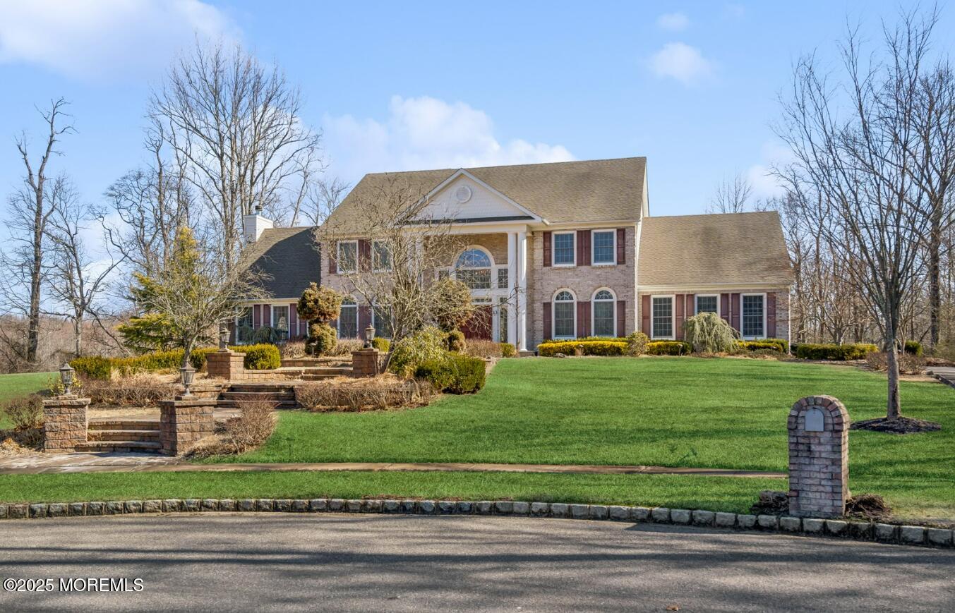 13 Risa Benjamin Way Freehold, NJ 07728 - Photo 54 of 65 a front view of a house with a garden