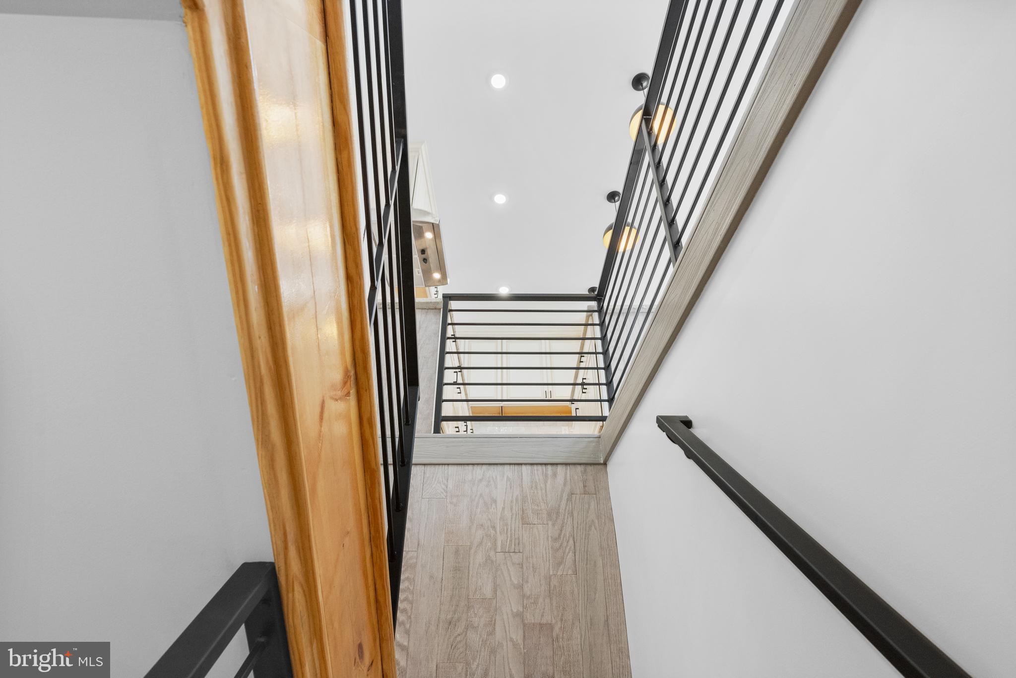 2305 North 50th Street Philadelphia, PA 19131 - Photo 14 of 33 a view of a hallway with wooden floor and staircase