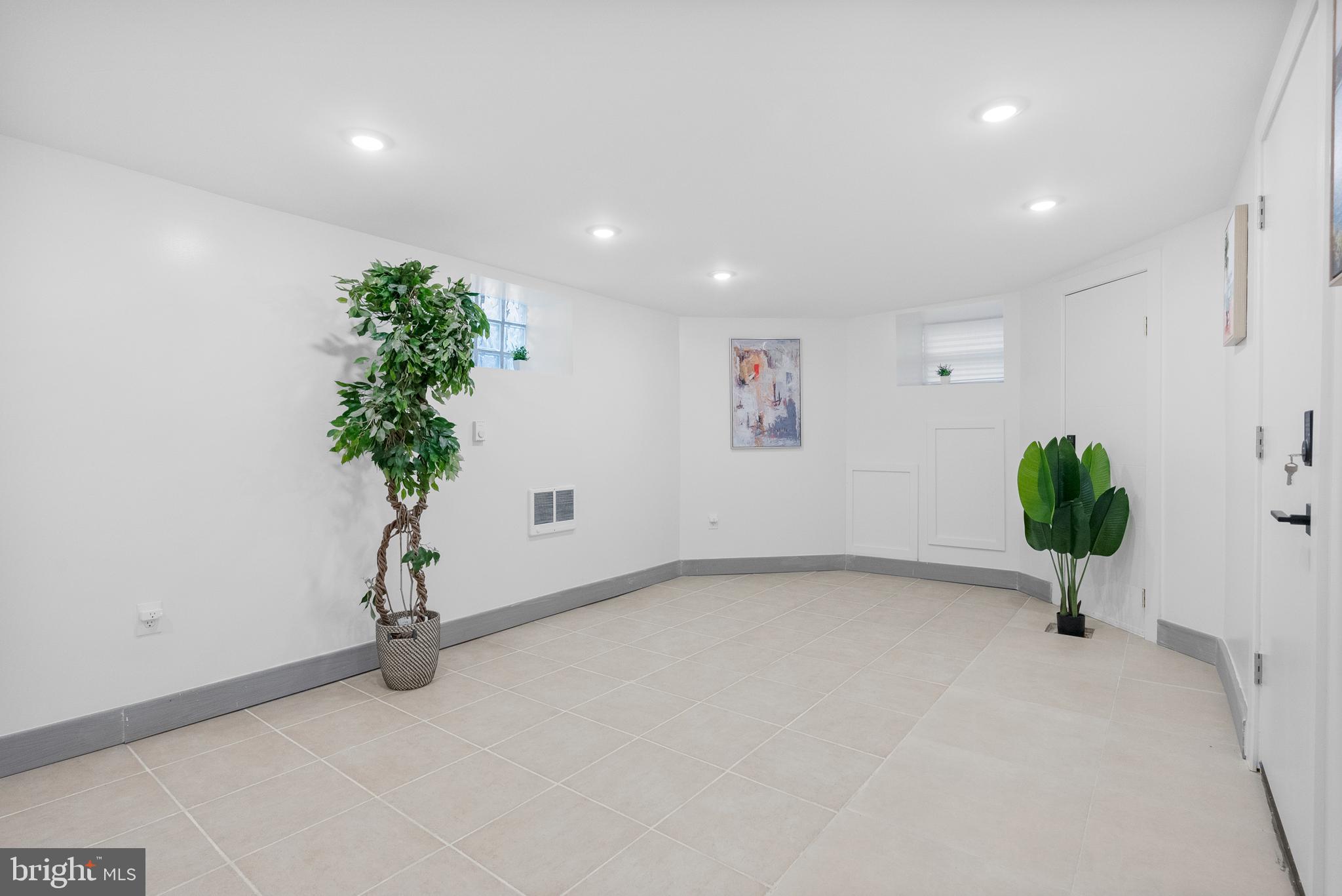 2305 North 50th Street Philadelphia, PA 19131 - Photo 15 of 33 an empty room with a potted plant