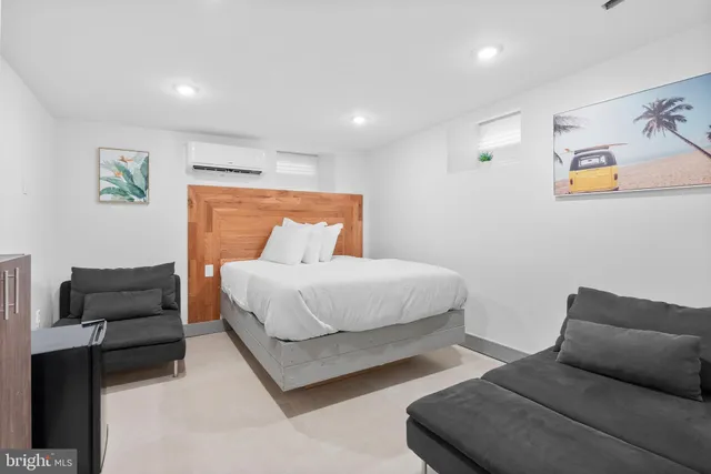 a bedroom with bed and window