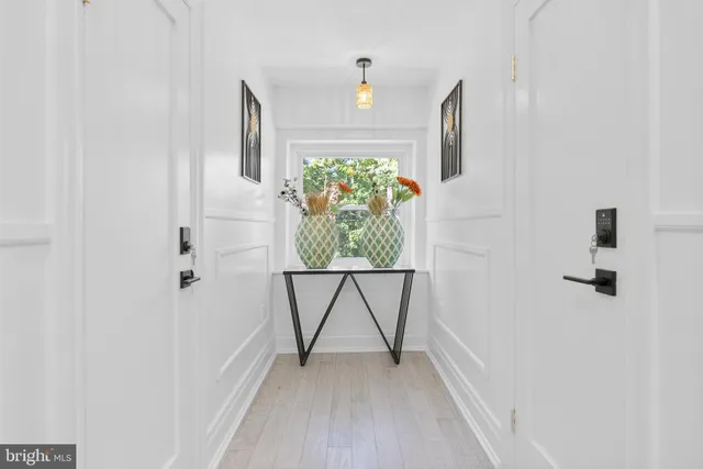 a view of an entryway with wooden floor