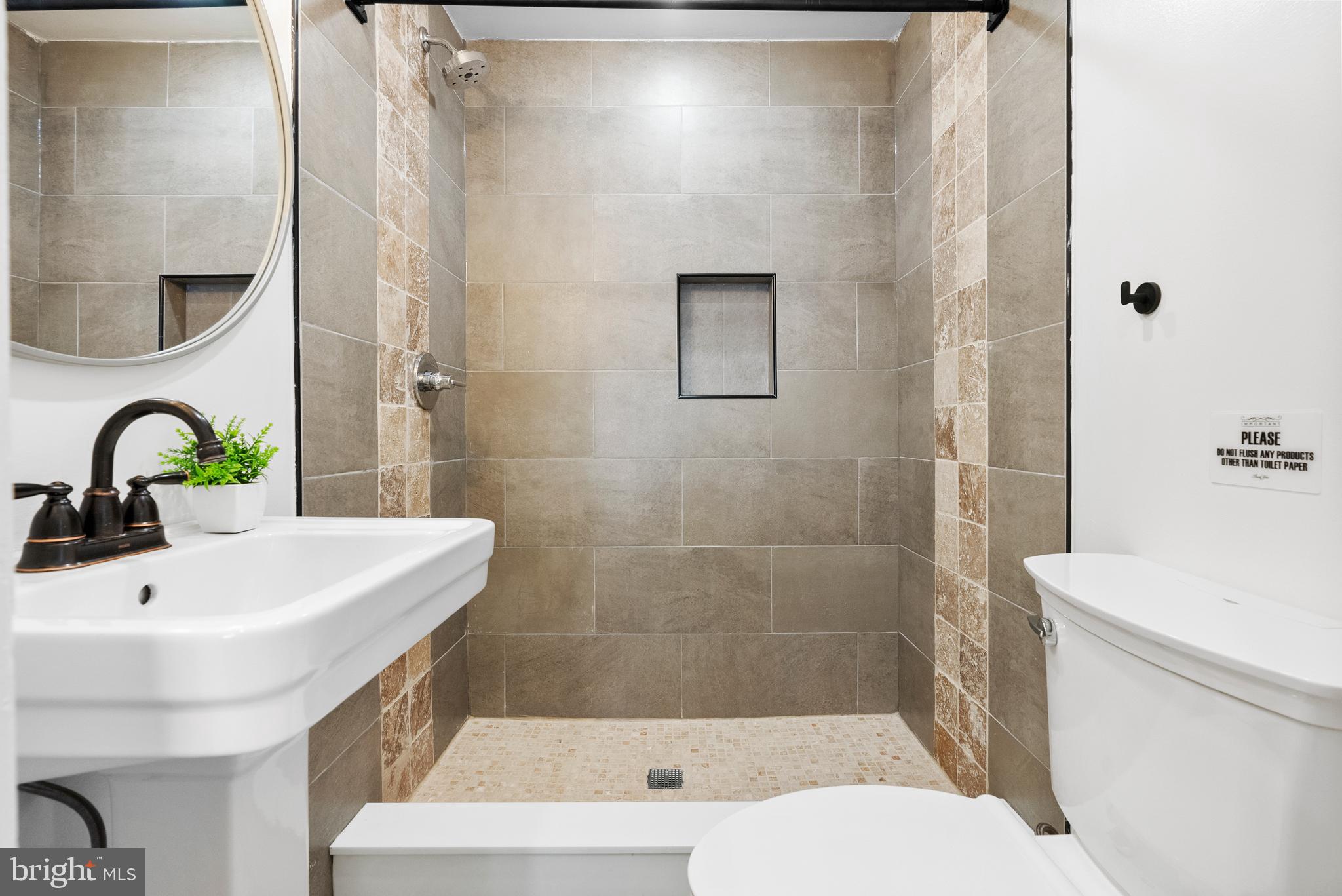 2305 North 50th Street Philadelphia, PA 19131 - Photo 27 of 33 a bathroom with a sink a toilet and shower
