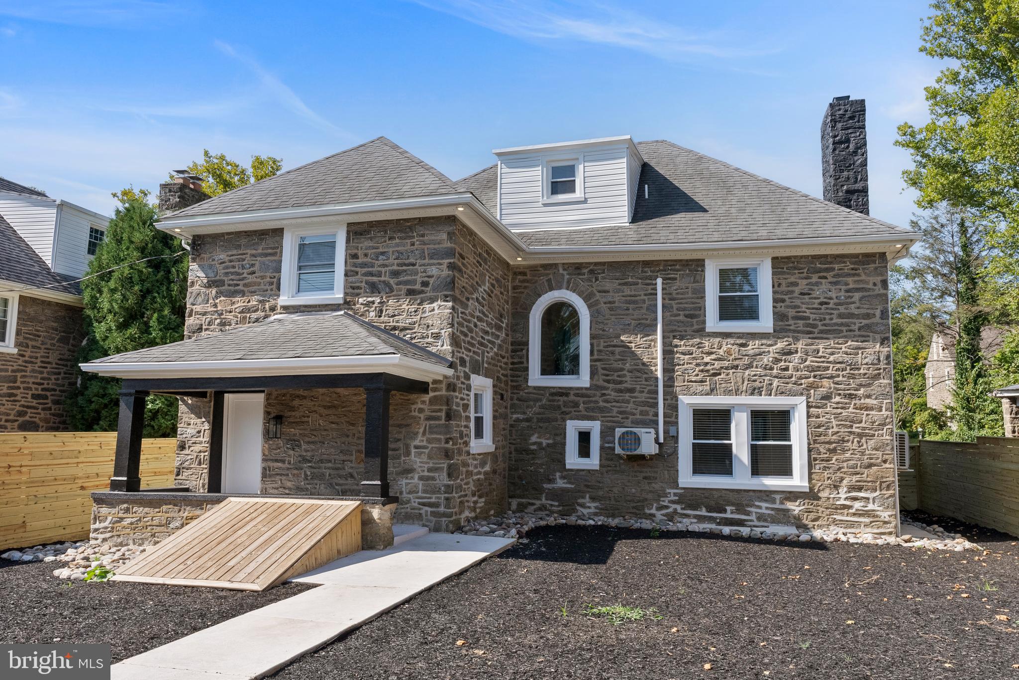 2305 North 50th Street Philadelphia, PA 19131 - Photo 3 of 33 a front view of a house with a yard and garage
