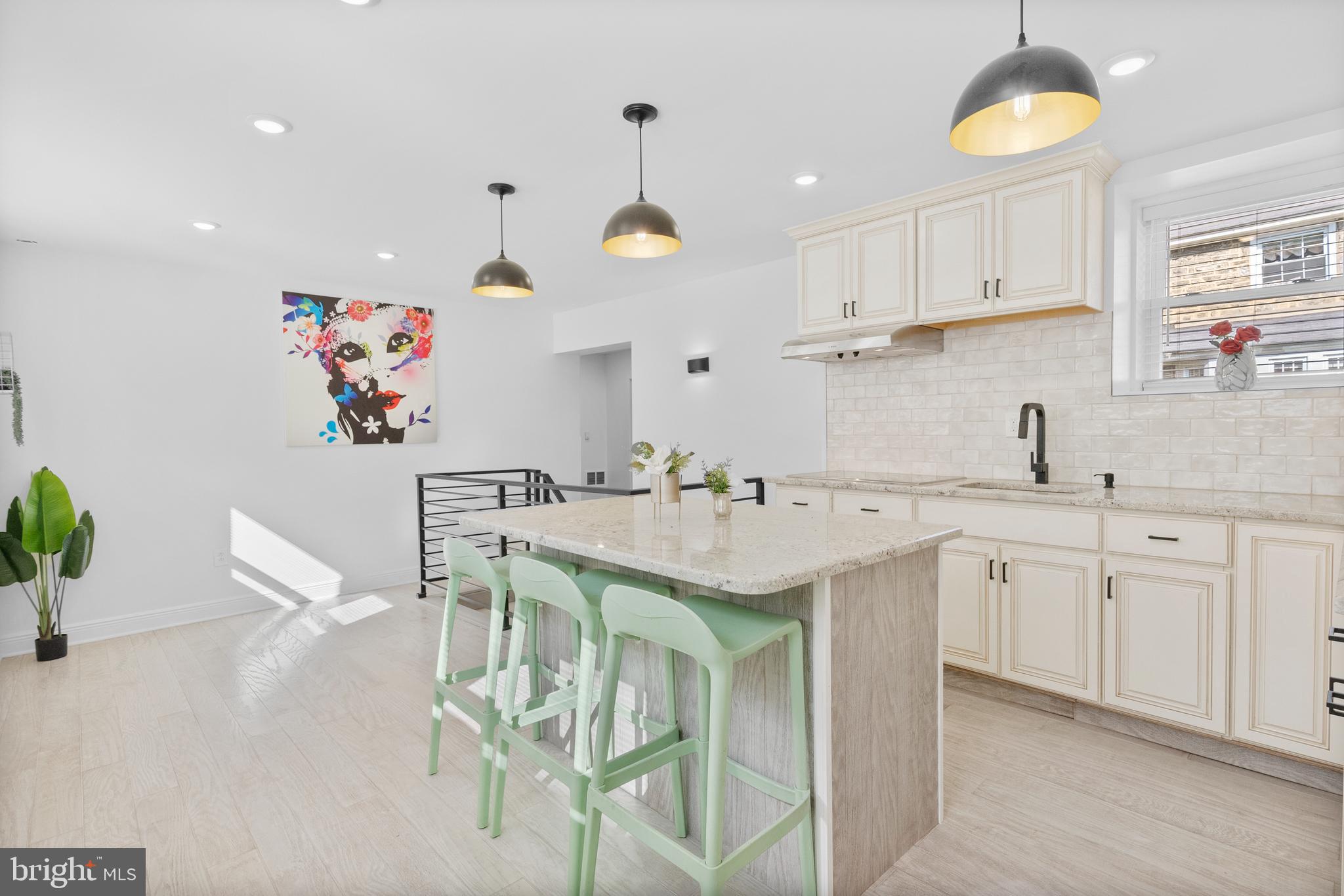 2305 North 50th Street Philadelphia, PA 19131 - Photo 7 of 33 a kitchen with a sink and cabinets
