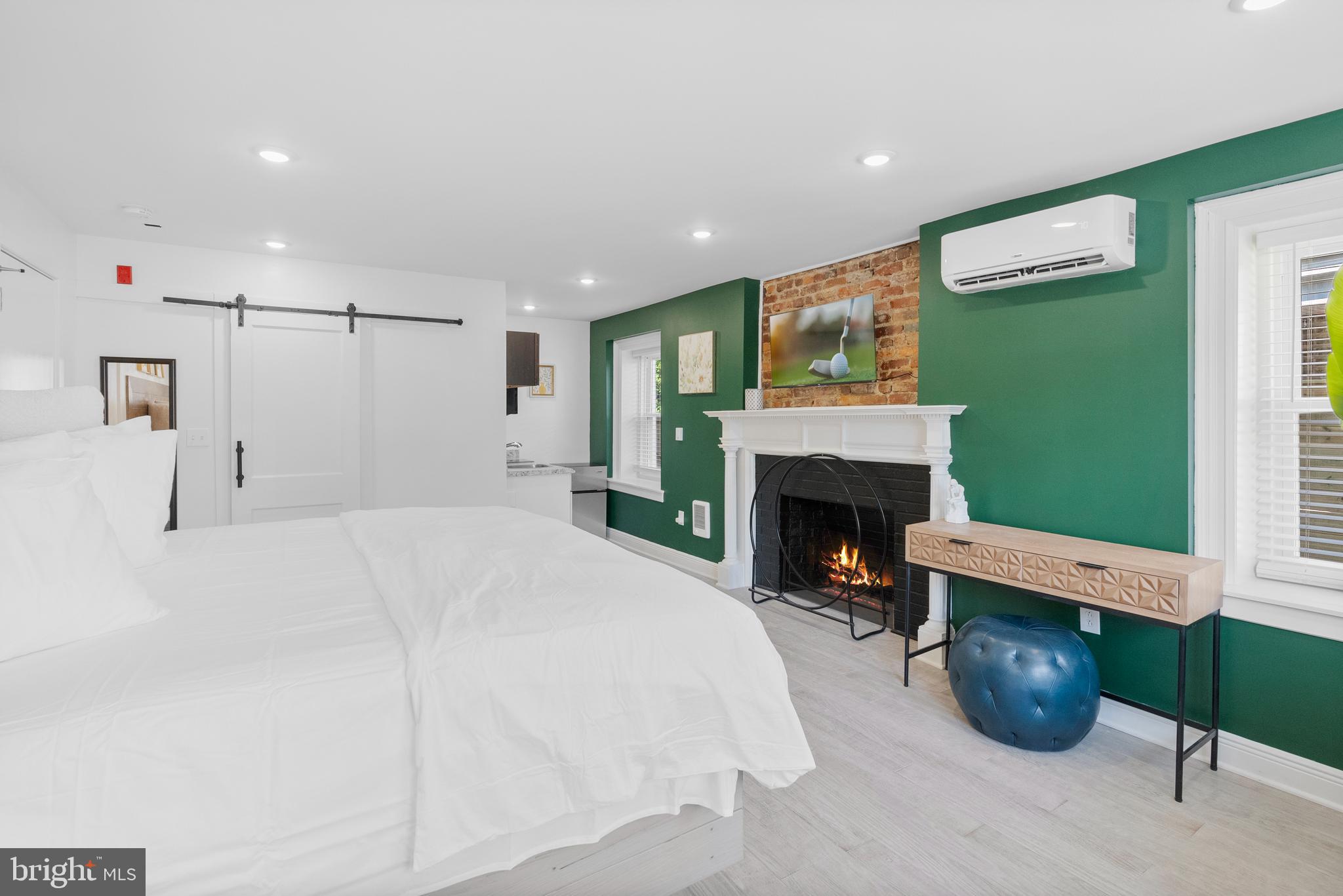 2305 North 50th Street Philadelphia, PA 19131 - Photo 10 of 33 a bed room with furniture and a fireplace