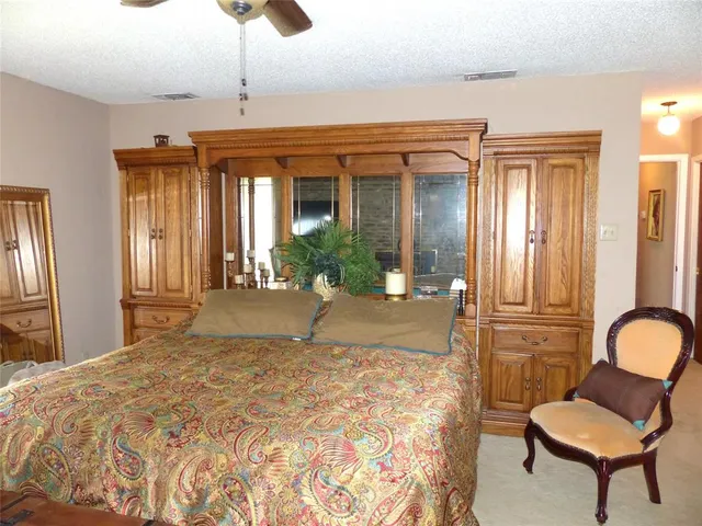 a view of a livingroom with furniture and a window