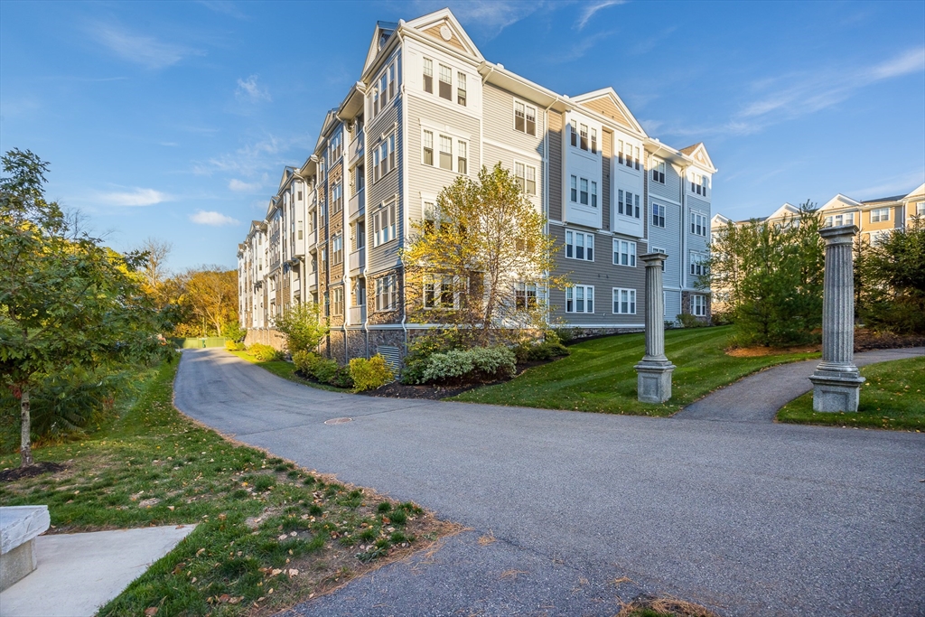 4 Francis Drive, Unit 207 Andover, MA 01810 - Photo 1 of 21 a view of a tall building next to a yard