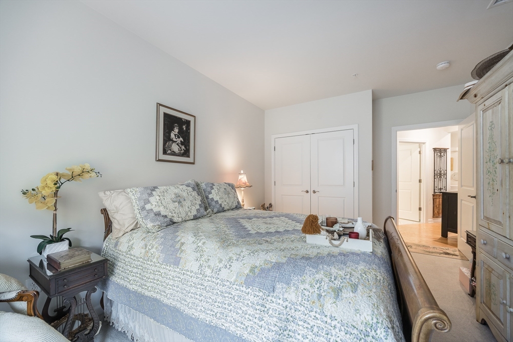 4 Francis Drive, Unit 207 Andover, MA 01810 - Photo 13 of 21 a bed room with a bed and a couch