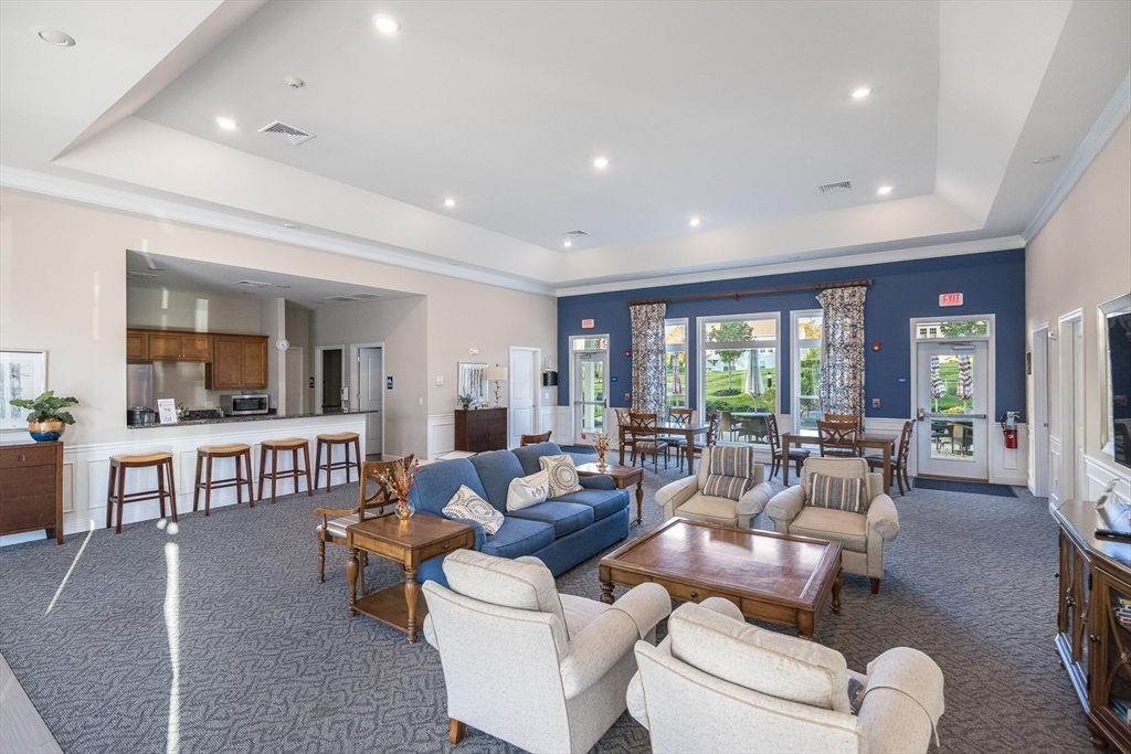 4 Francis Drive, Unit 207 Andover, MA 01810 - Photo 18 of 21 a living room with furniture and a table