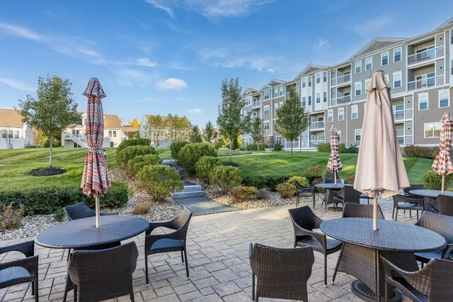 a view of a building with a yard