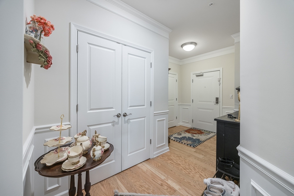 4 Francis Drive, Unit 207 Andover, MA 01810 - Photo 2 of 21 a bedroom with furniture and a potted plant