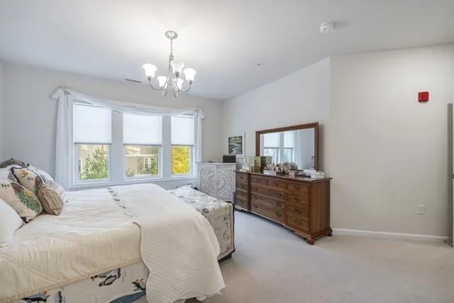 a bathroom with a double vanity sink a mirror and a shower