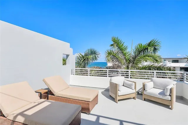 a sign board with buildings in the background