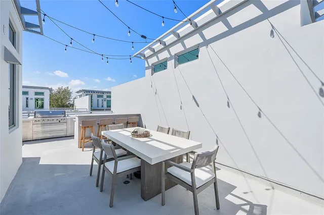 a front view of a multi story building with yard