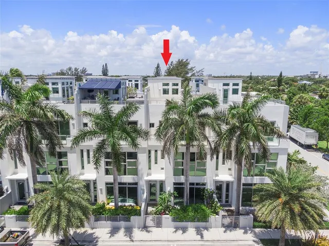 a kitchen with kitchen island granite countertop a sink and cabinets