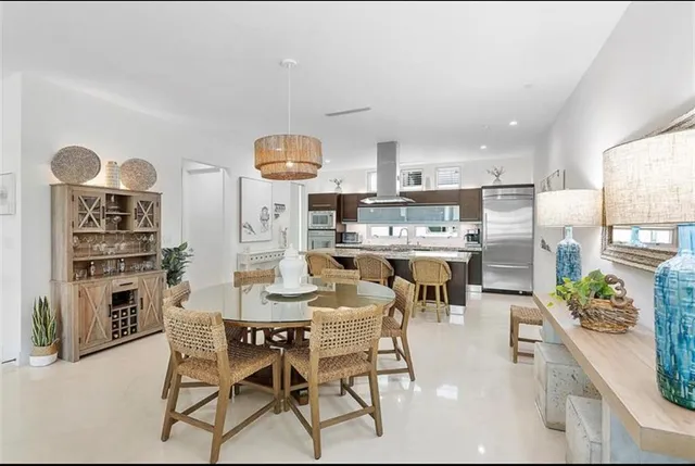 a living room with furniture ceiling fan and a rug