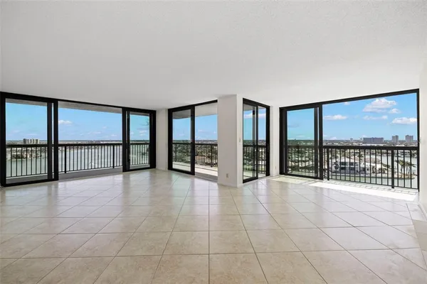 a view of an empty room with a large window