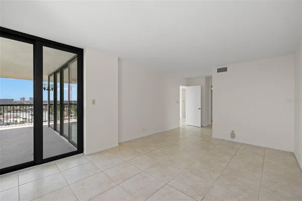 a room with gym equipment and a large window