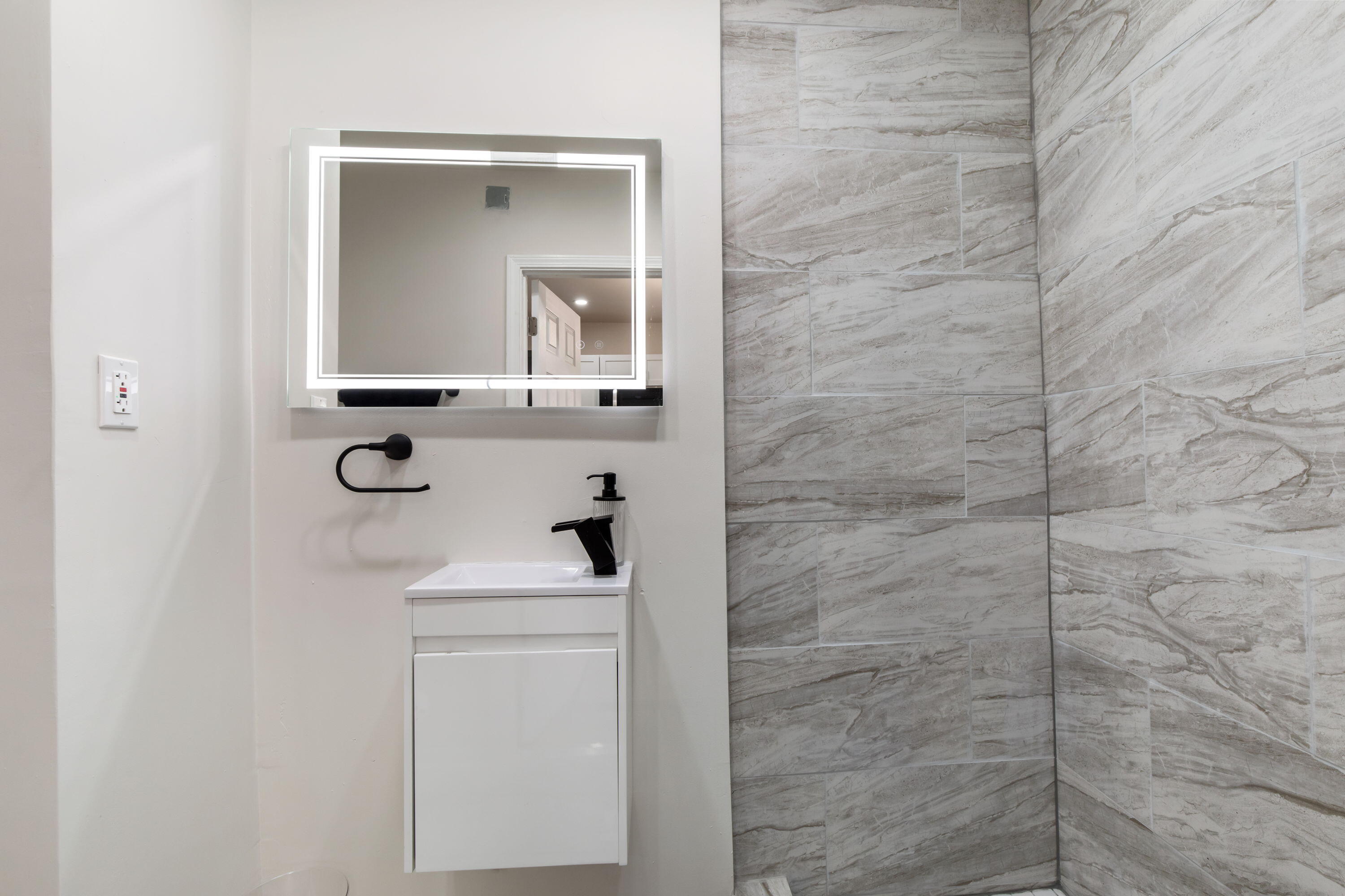 560 Rhode Island Ct. Gary, IN 46402 - Photo 11 of 49 a bathroom with a sink a toilet and mirror