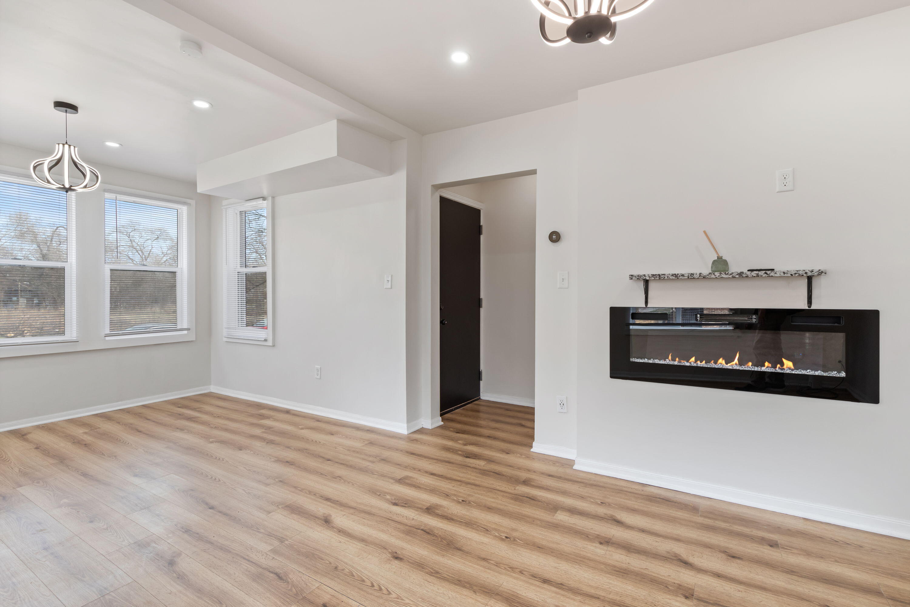 560 Rhode Island Ct. Gary, IN 46402 - Photo 31 of 49 a view of a livingroom with wooden floor and a fireplace