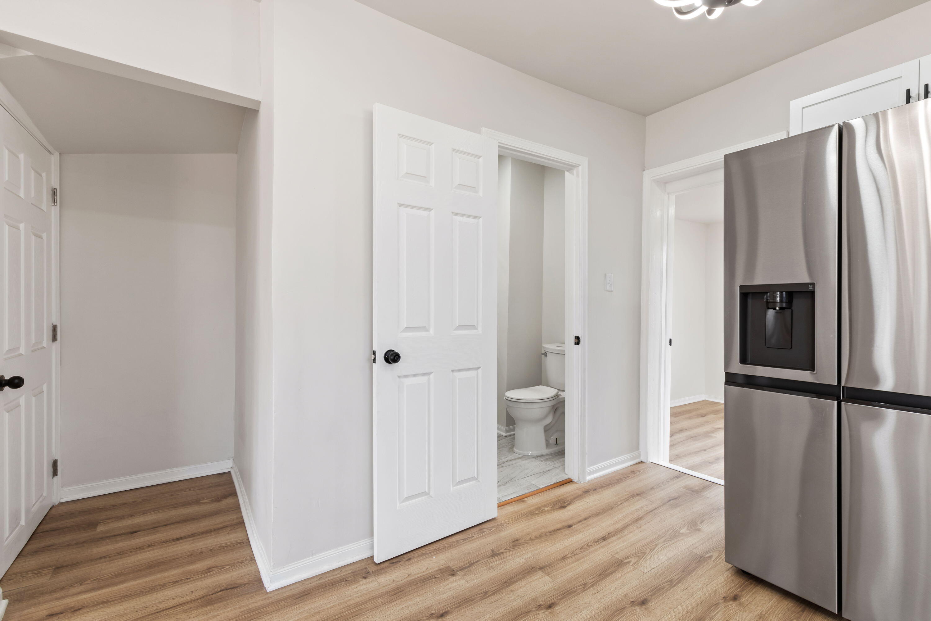 560 Rhode Island Ct. Gary, IN 46402 - Photo 35 of 49 a view of a kitchen with wooden floor and refrigerator