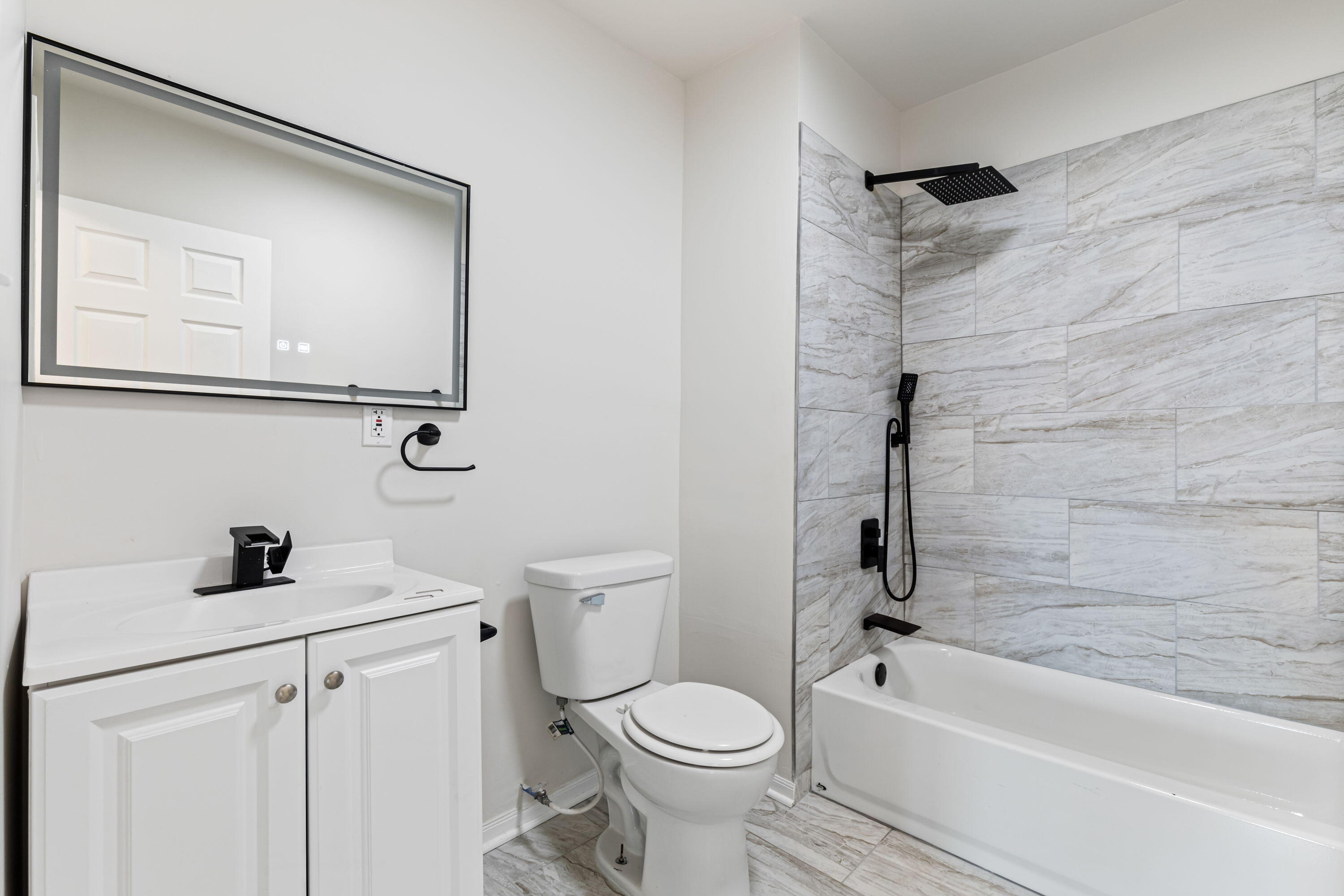 560 Rhode Island Ct. Gary, IN 46402 - Photo 41 of 49 a bathroom with a sink toilet and shower