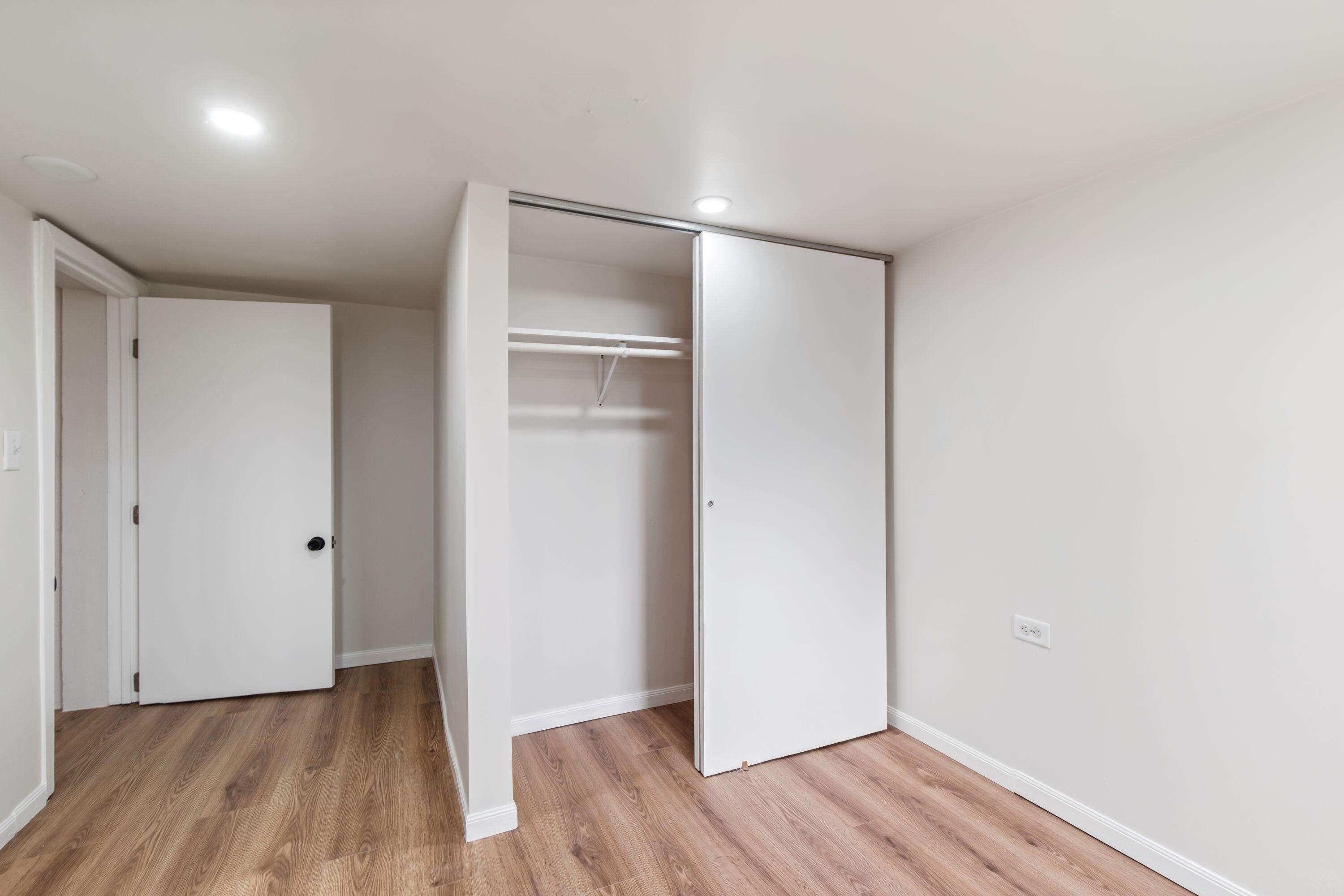 560 Rhode Island Ct. Gary, IN 46402 - Photo 43 of 49 a view of an empty room with wooden floor & closet