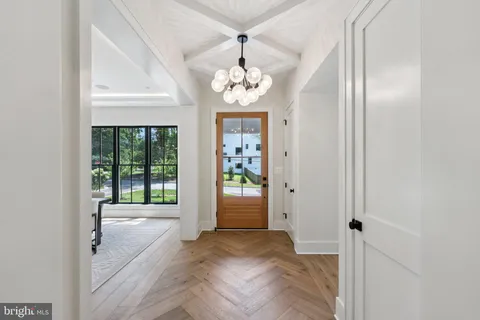 a view of an entryway with wooden floor