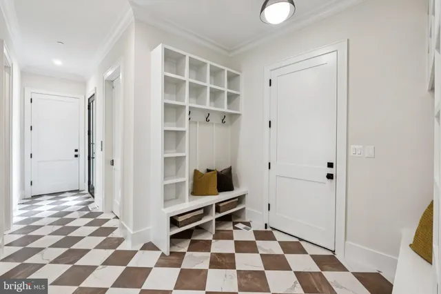 a view of a big room with wooden floor and windows