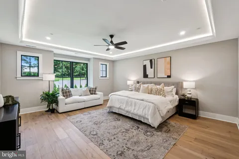 a spacious bedroom with a large bed and a couch