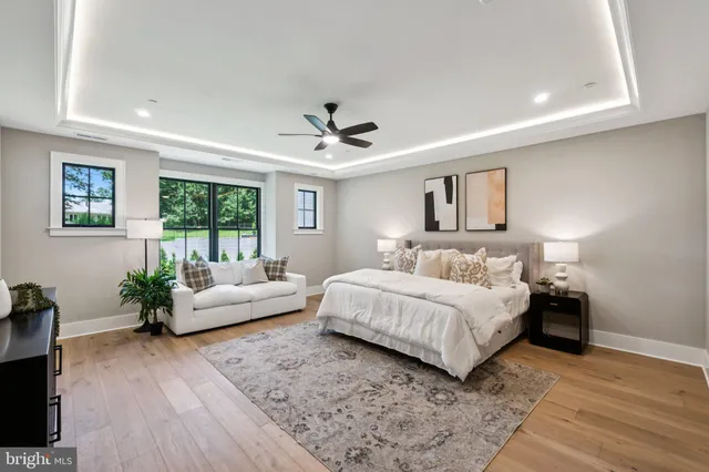 a spacious bedroom with a large bed and a couch