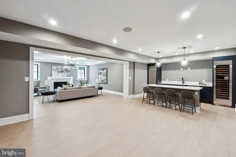 a kitchen with a stove a refrigerator and a sink