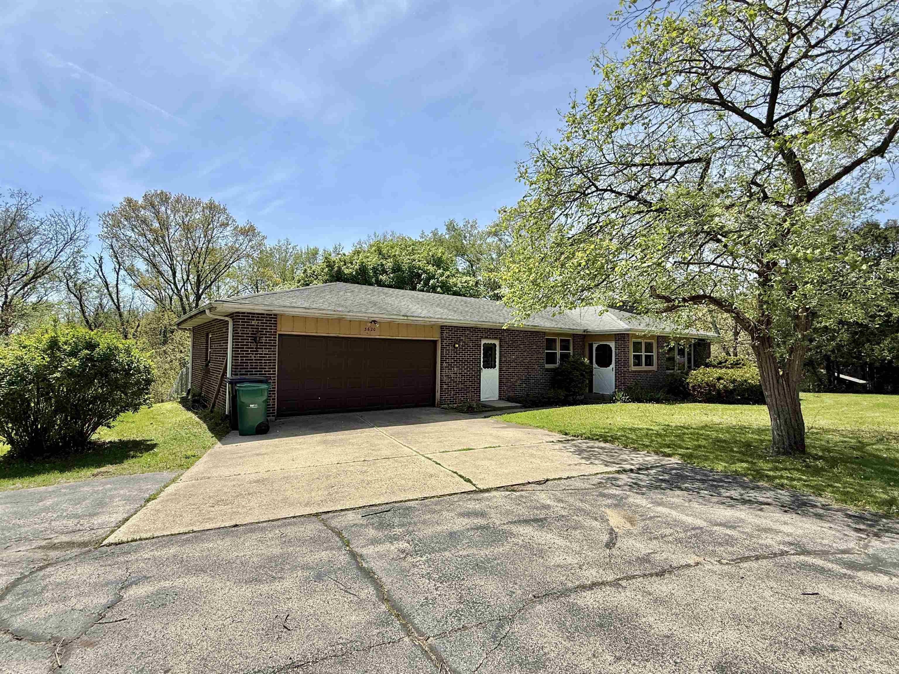 3620 Valerie Road Roscoe, IL 61073 - Photo 24 of 26 a front view of a house with a yard and garage