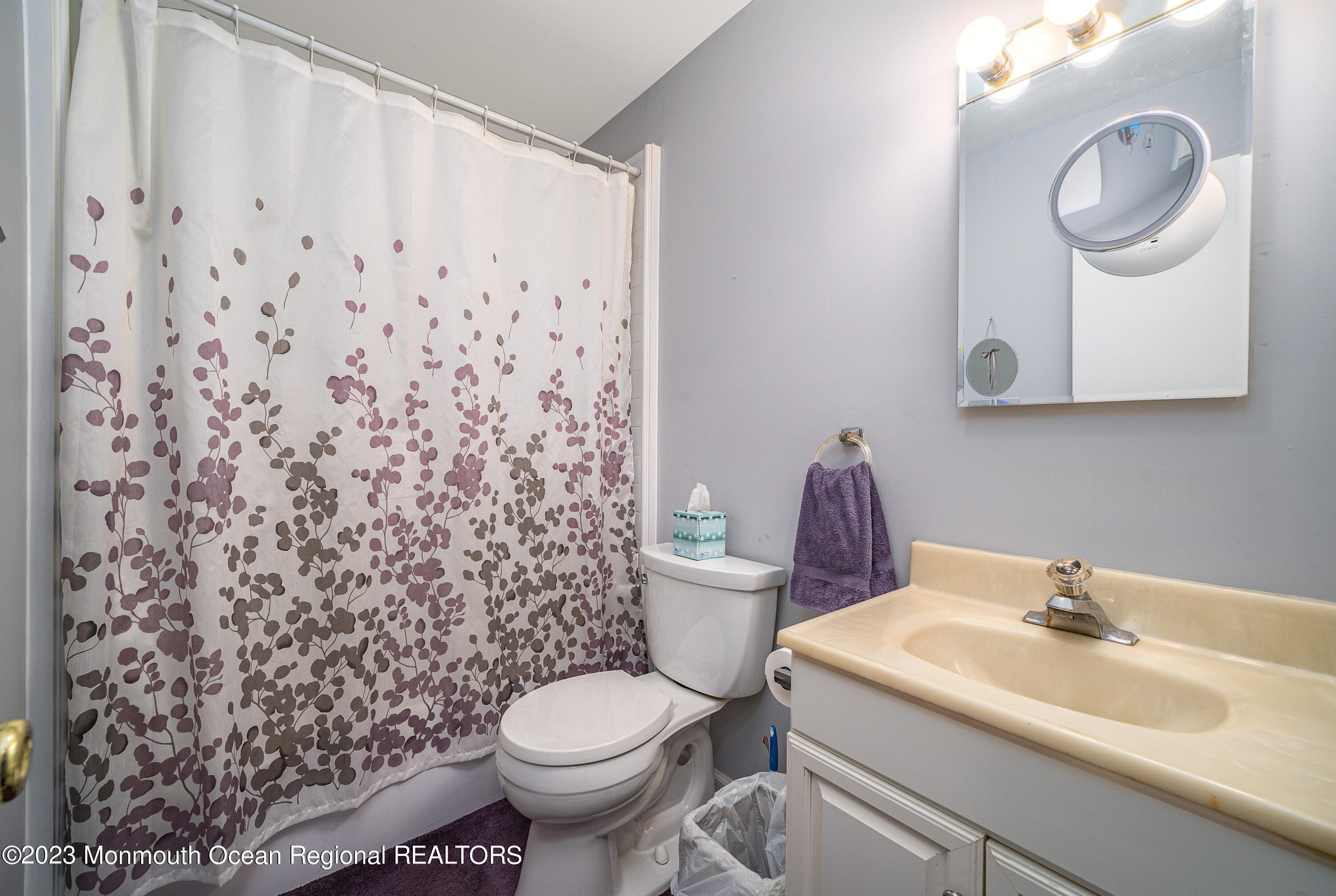 501 First Street Toms River, NJ 08757 - Photo 17 of 32 a bathroom with a toilet sink and mirror