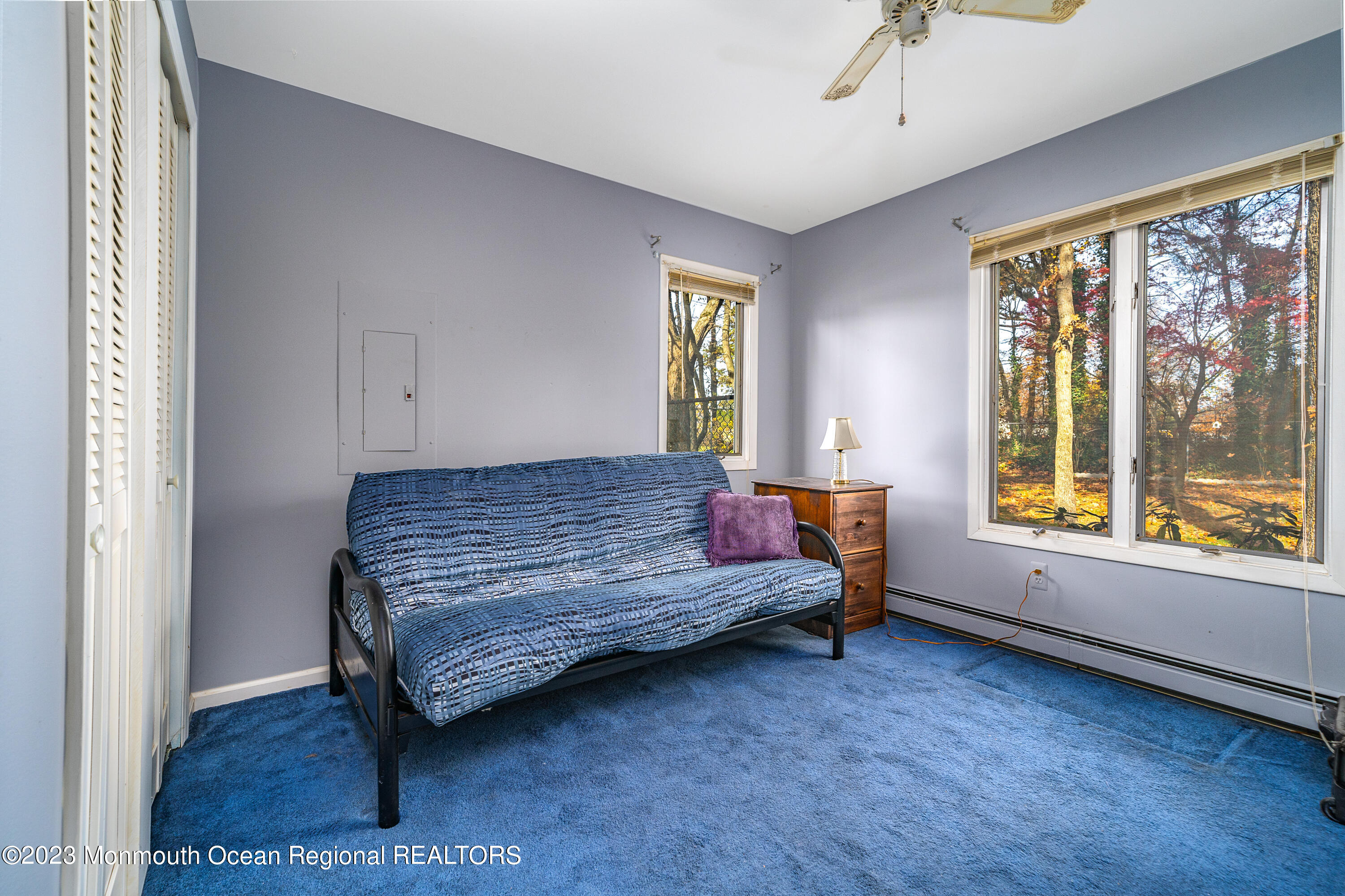 501 First Street Toms River, NJ 08757 - Photo 18 of 32 a bedroom with a bed and large windows