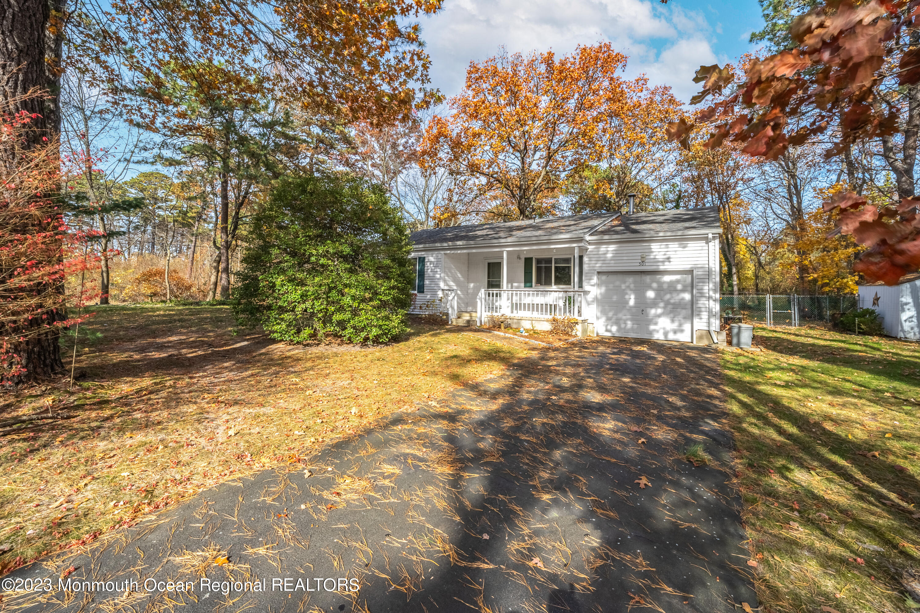 501 First Street Toms River, NJ 08757 - Photo 2 of 32 a front view of a house with a yard and trees