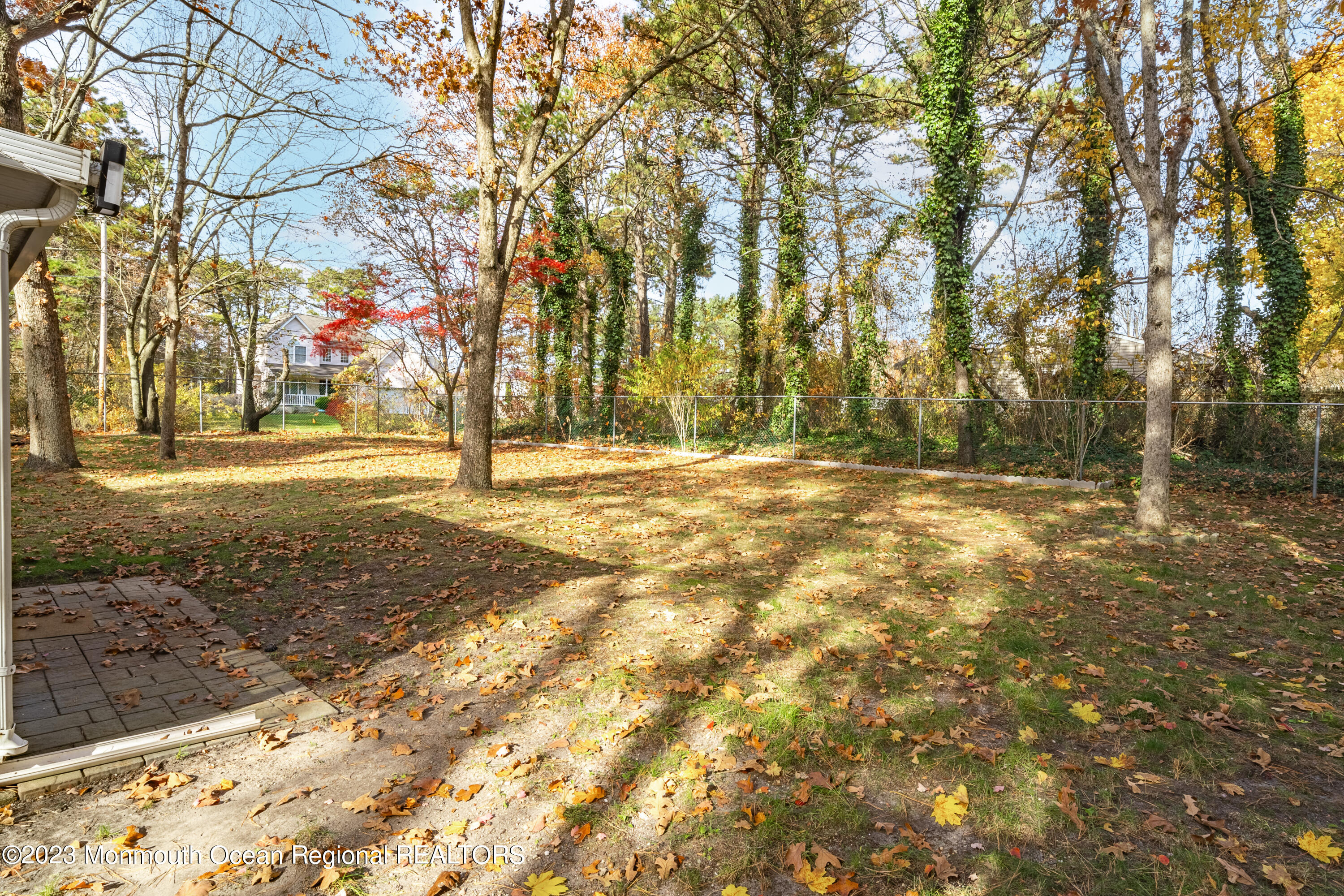 501 First Street Toms River, NJ 08757 - Photo 21 of 32 a view of yard with tree and wooden fence