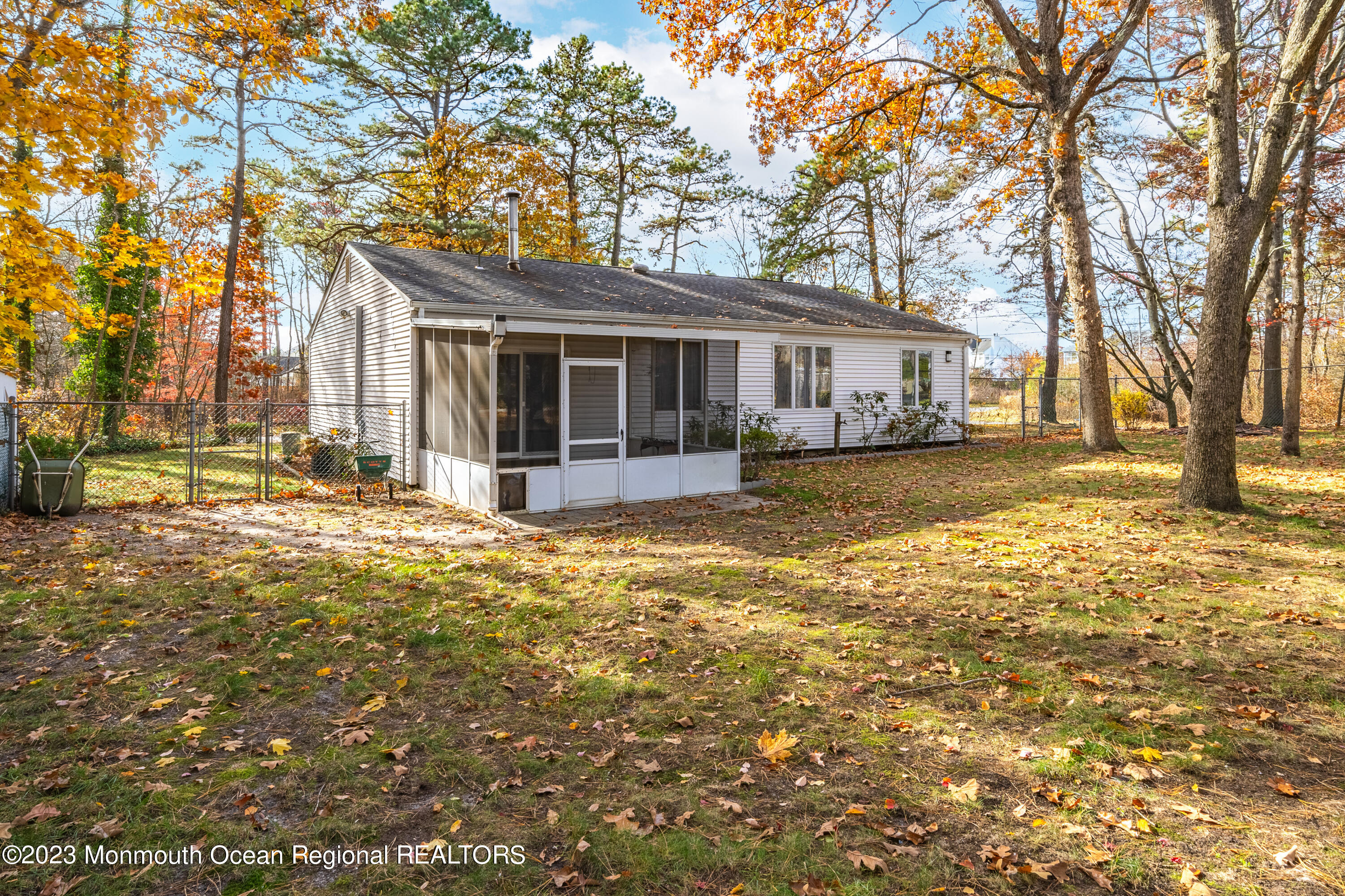 501 First Street Toms River, NJ 08757 - Photo 4 of 32 a view of a house with a yard covered with trees