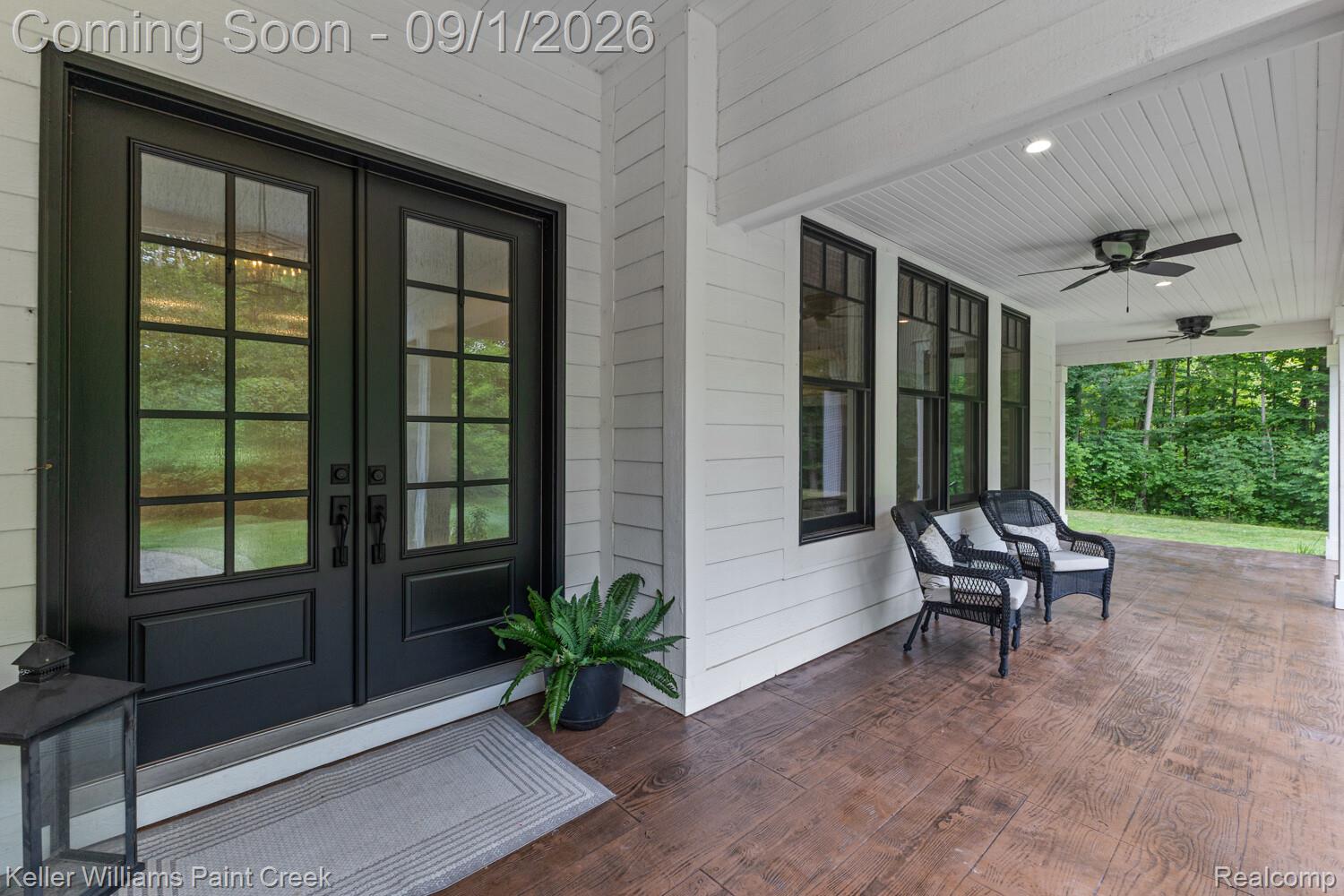 66927 Campground Road Washington, MI 48095 - Photo 10 of 60 Enjoyable 51x14 covered wrap around porch with porch swing and ceiling fans