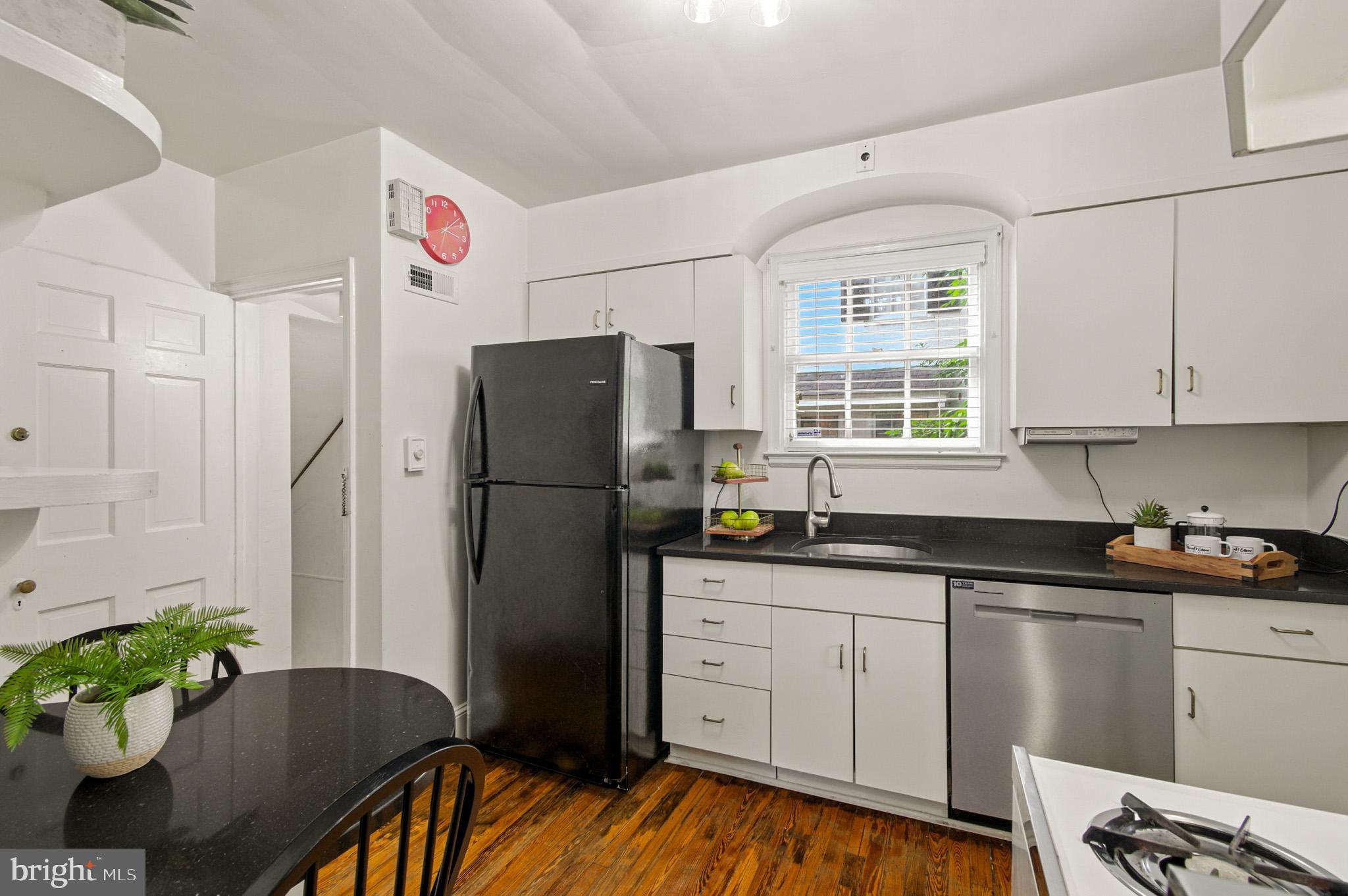310 Paddington Road Baltimore, MD 21212 - Photo 14 of 59 a kitchen with granite countertop a refrigerator and a sink