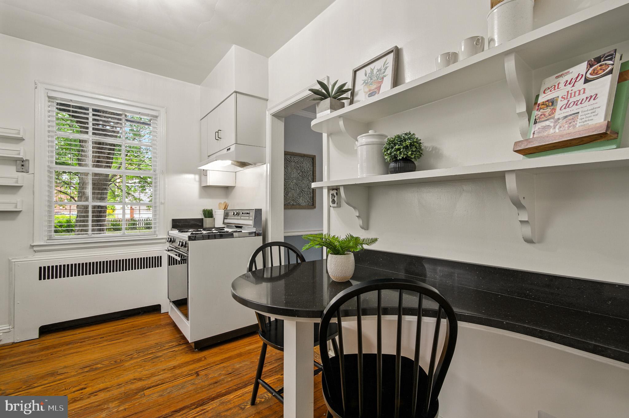 310 Paddington Road Baltimore, MD 21212 - Photo 17 of 59 a view of a dining room with furniture window and wooden floor