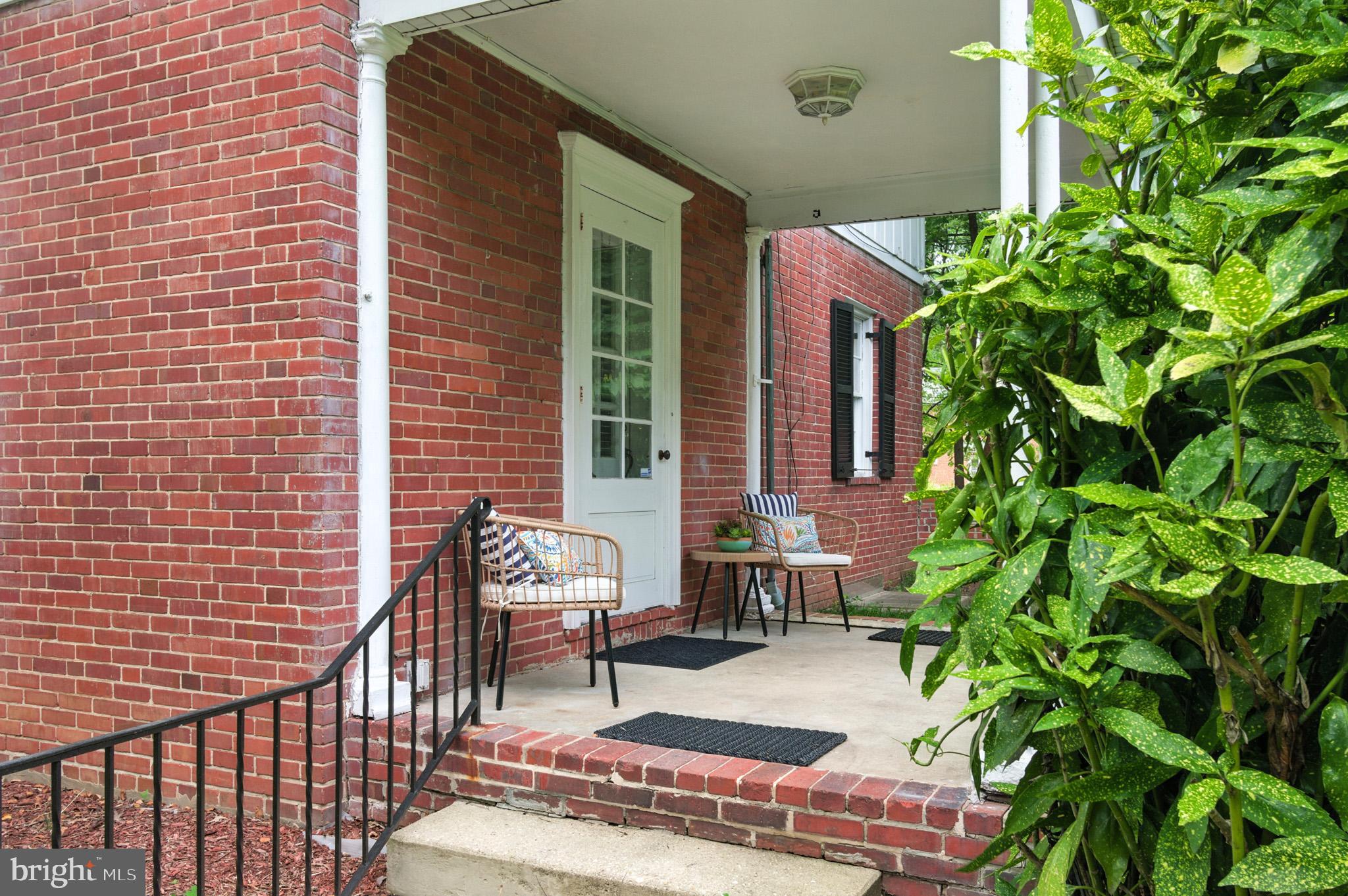 310 Paddington Road Baltimore, MD 21212 - Photo 2 of 59 a balcony with chairs and a potted plant