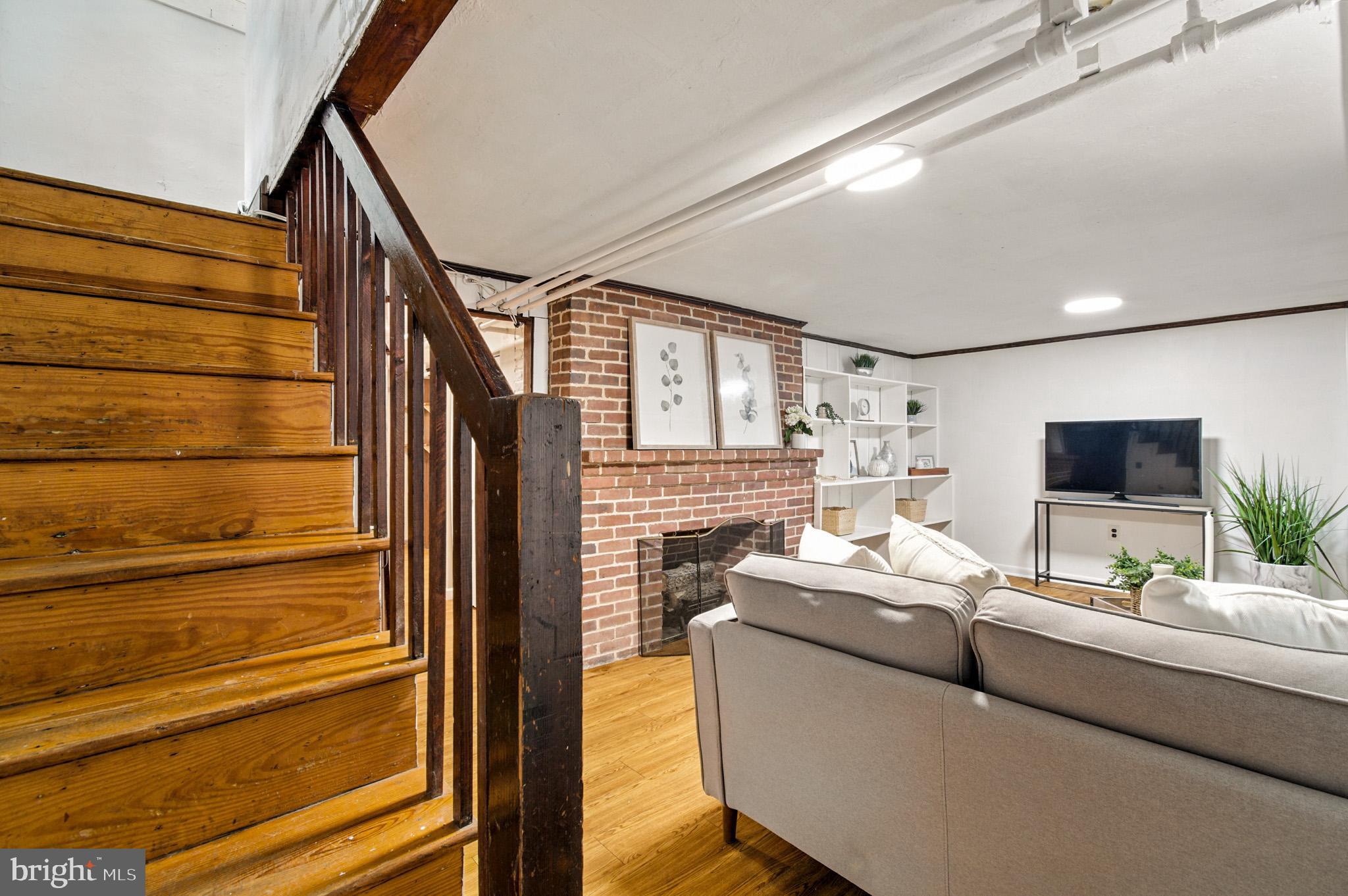 310 Paddington Road Baltimore, MD 21212 - Photo 26 of 59 a living room with furniture and a flat screen tv