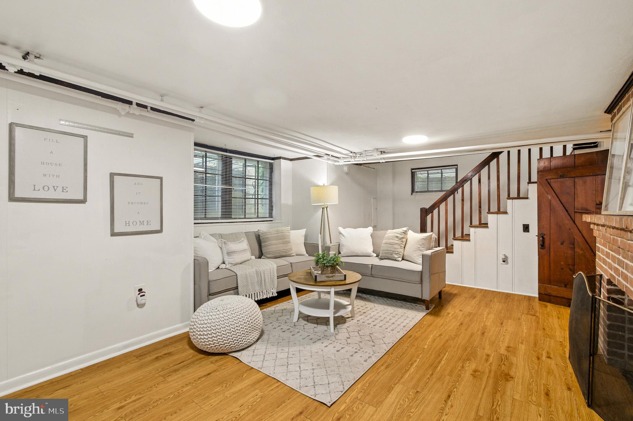 310 Paddington Road Baltimore, MD 21212 - Photo 27 of 59 a living room with furniture and a wooden floor