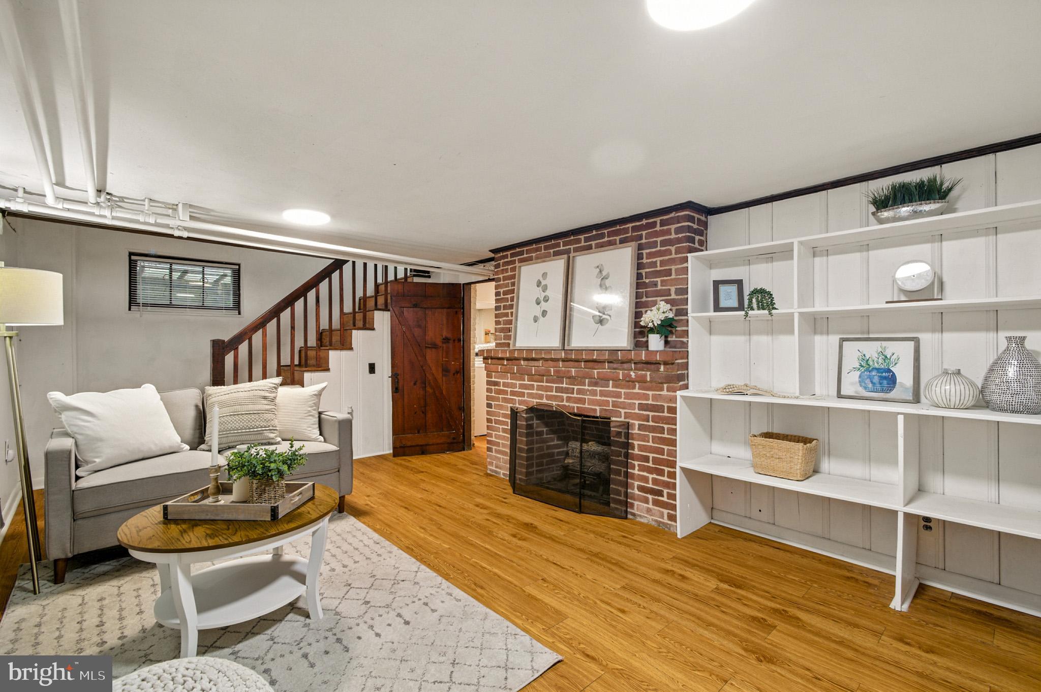 310 Paddington Road Baltimore, MD 21212 - Photo 28 of 59 a living room with furniture and a fireplace