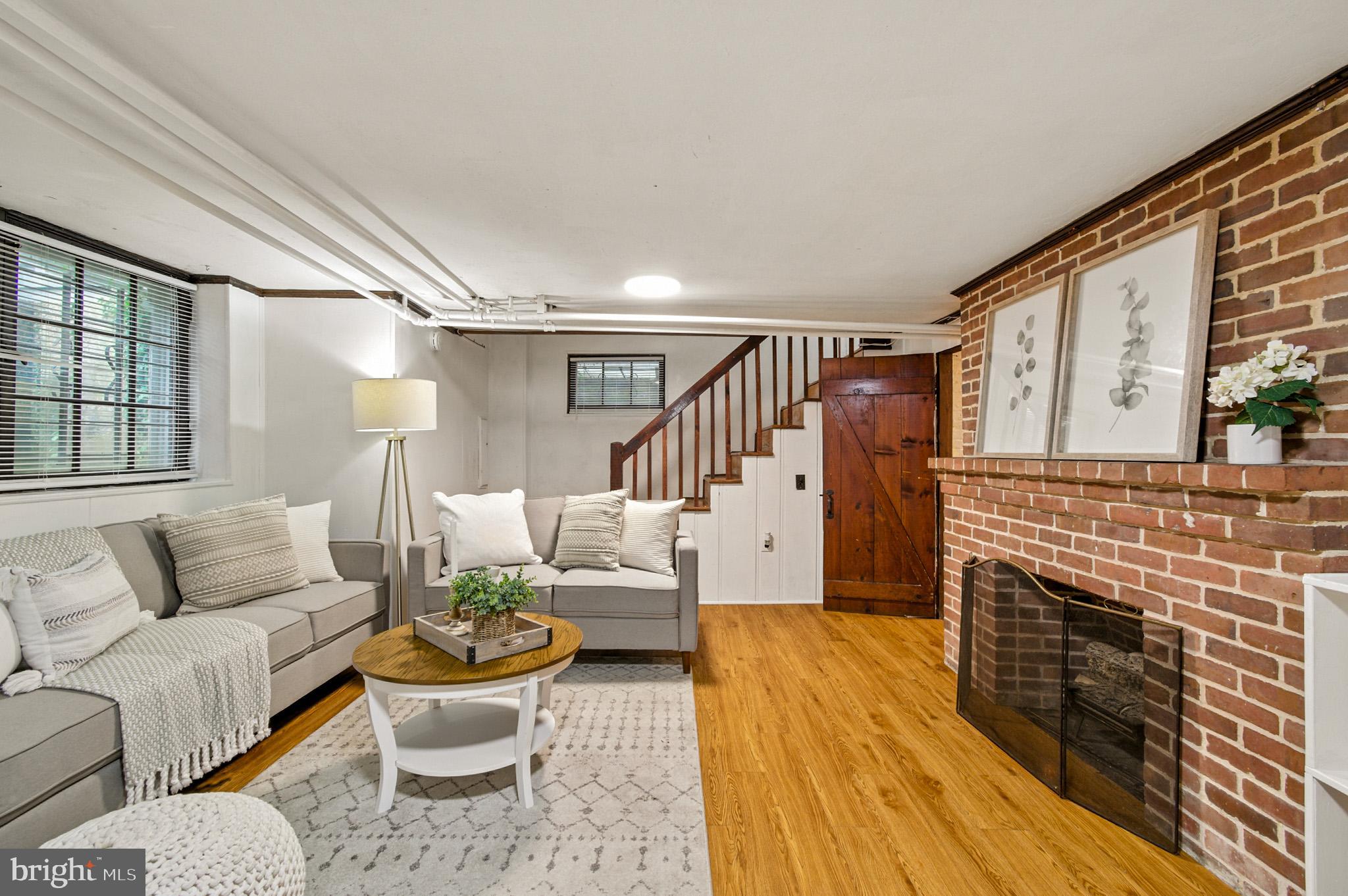 310 Paddington Road Baltimore, MD 21212 - Photo 29 of 59 a living room with furniture and a fireplace