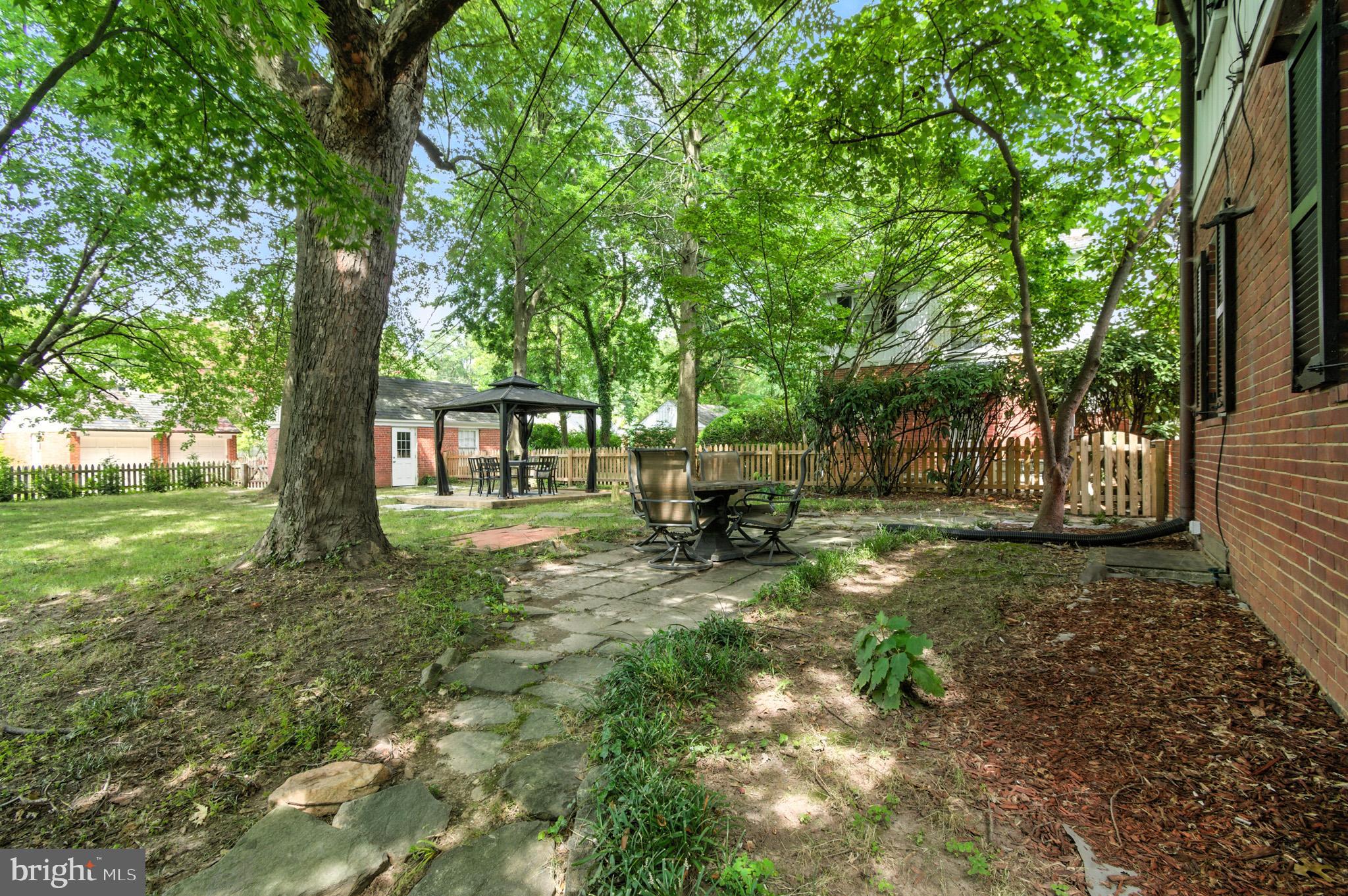310 Paddington Road Baltimore, MD 21212 - Photo 41 of 59 a view of backyard with table and chairs and large trees